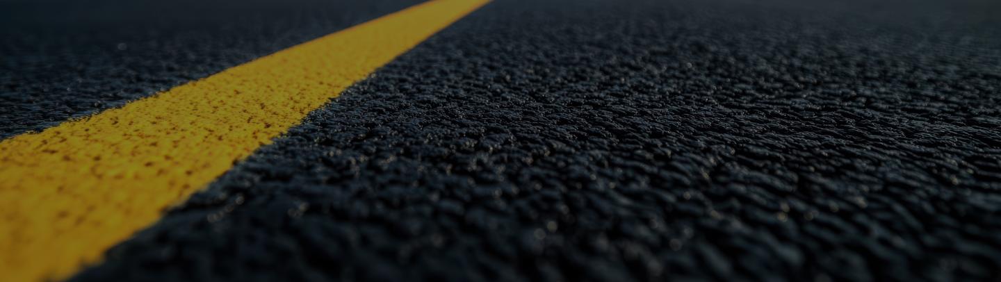 Close up of lines on asphalt pavement